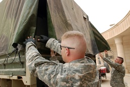 Multi-National Division - Baghdad Soldiers bring gifts to Victory Base Complex area school