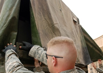 Multi-National Division - Baghdad Soldiers bring gifts to Victory Base Complex area school