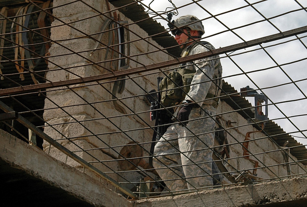 Infantry Soldiers Conduct Mosul Raid Through Rain and Shine