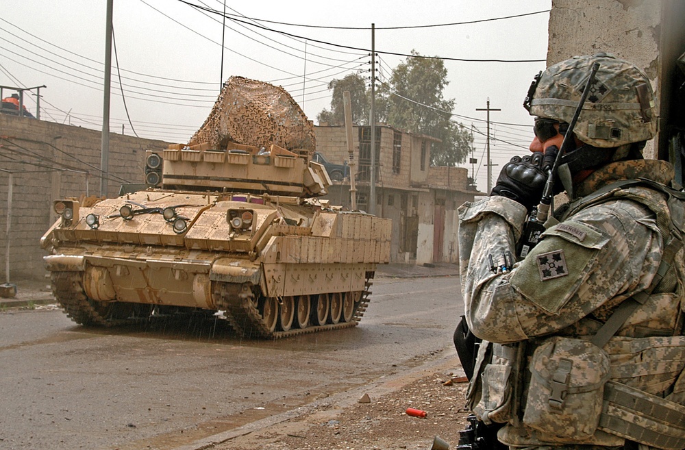 Infantry Soldiers conduct Mosul raid through rain and shine