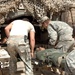 Soldiers perform medical treatment on suicide bomb victims