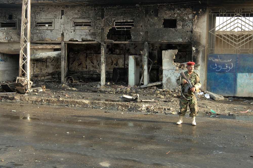 Iraqi Police Patrol Site of VBIED Attack in Baqubah