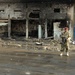 Iraqi Police Patrol Site of VBIED Attack in Baqubah