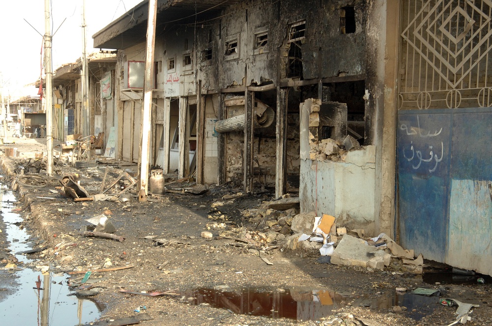 Iraqi Police Patrol Site of VBIED Attack in Baqubah