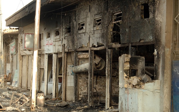 Iraqi Police Patrol Site of VBIED Attack in Baqubah