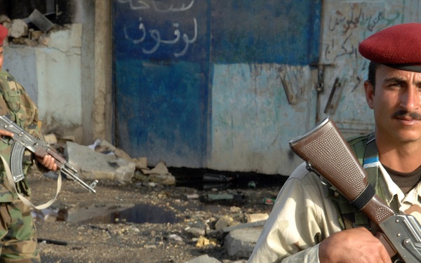 Iraqi Police Patrol Site of VBIED Attack in Baqubah