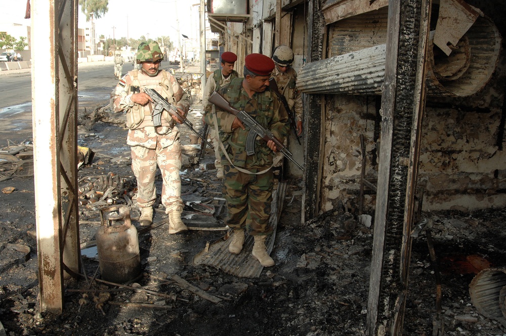 Iraqi Police Patrol Site of VBIED Attack in Baqubah