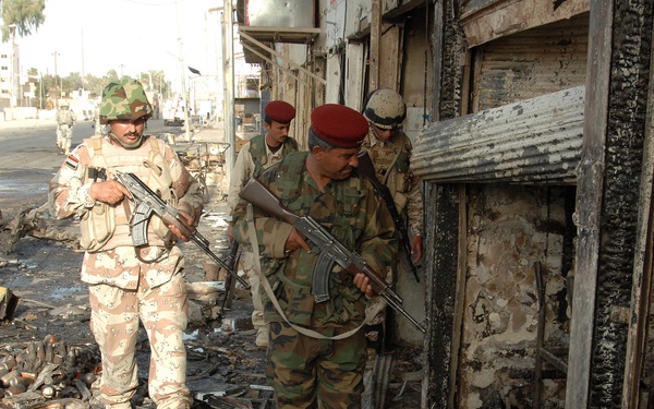 Iraqi Police Patrol Site of VBIED Attack in Baqubah