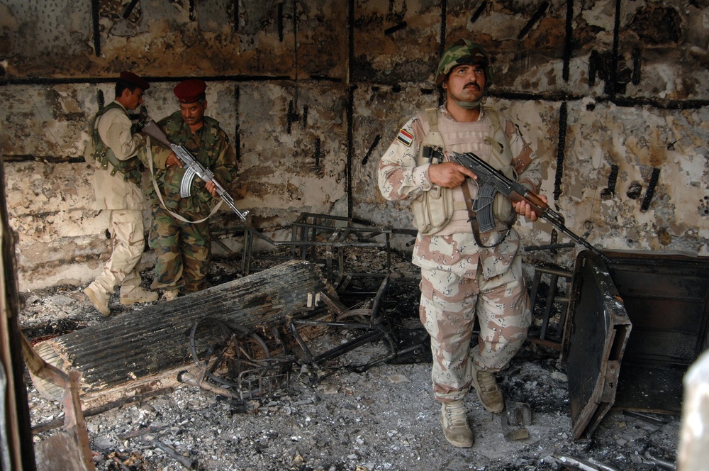 Iraqi Police Patrol Site of VBIED Attack in Baqubah