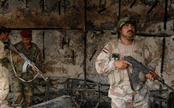 Iraqi Police Patrol Site of VBIED Attack in Baqubah