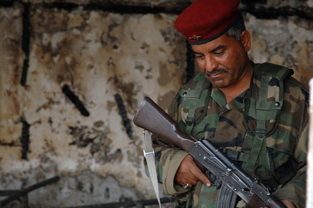 Iraqi Police Patrol Site of VBIED Attack in Baqubah