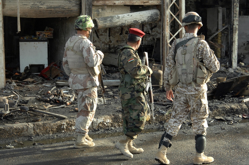 Iraqi Police Patrol Site of VBIED Attack in Baqubah