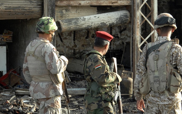 Iraqi Police Patrol Site of VBIED Attack in Baqubah