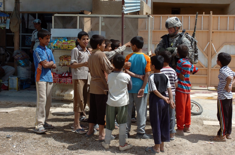 Strike Soldiers, IA patrol Abu Ghraib market, discover needs of local Iraqi citizens