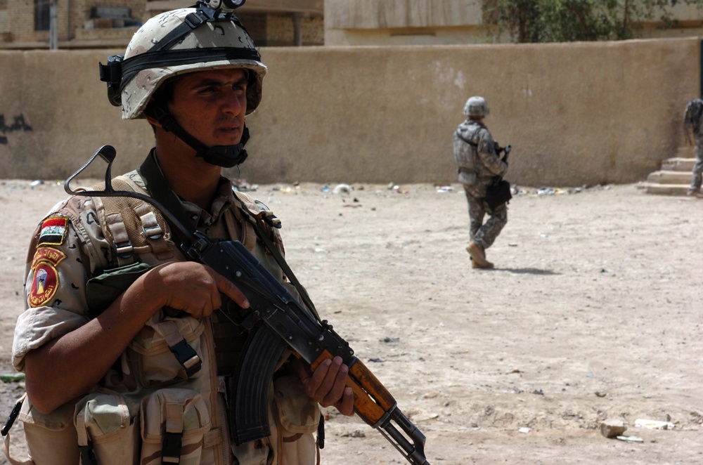 Strike Soldiers, IA patrol Abu Ghraib market, discover needs of local Iraqi citizens