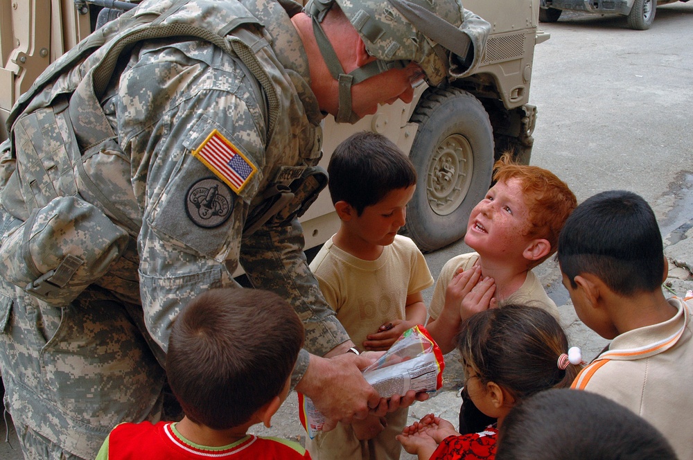 Killer Troop shows softer side to Iraqi children, Mosul