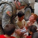 Killer Troop shows softer side to Iraqi children, Mosul