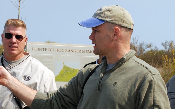 Soldiers study Normandy battlefield