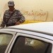 Iraqi police work with Marines at vehicle checkpoint