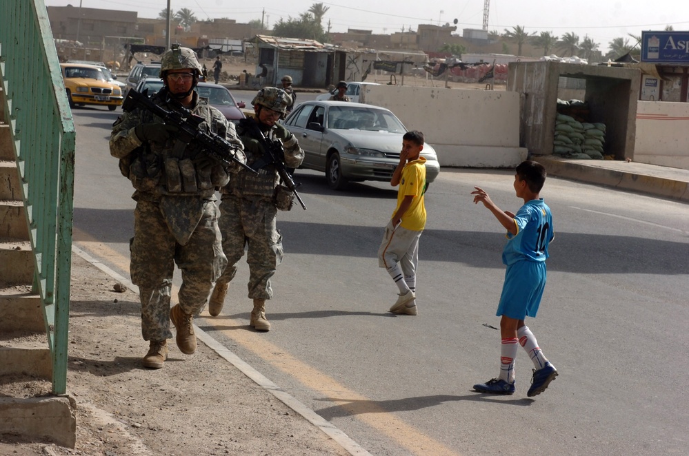 Cobra troops patrol streets of northwest Baghdad