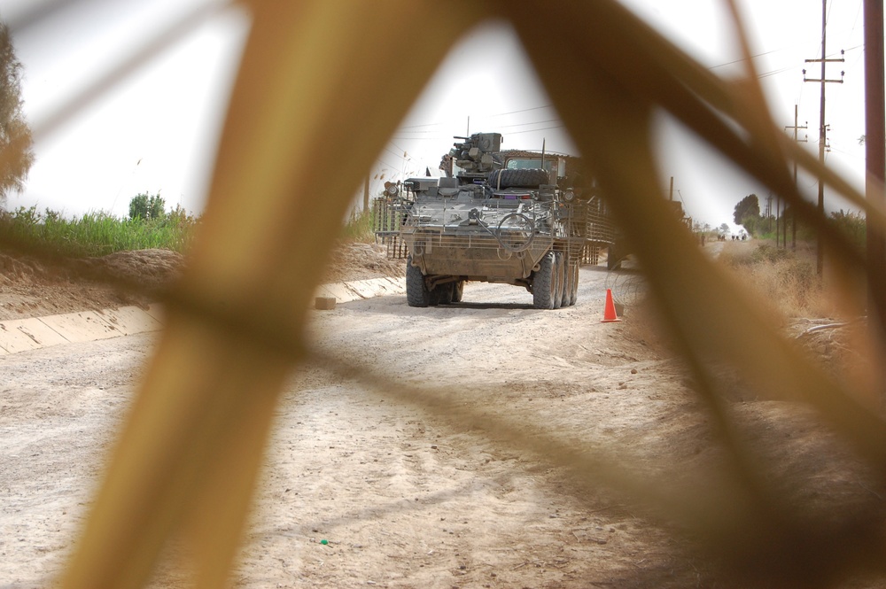 Wolfhounds patrol through Taji in sandstorm