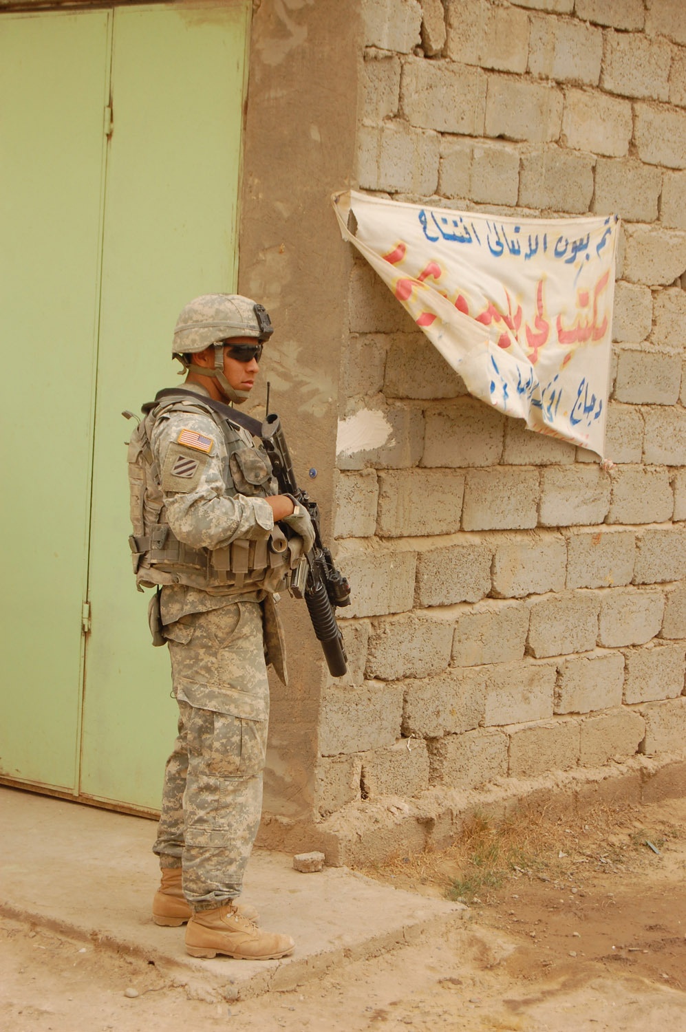 Wolfhounds patrol through Taji in sandstorm