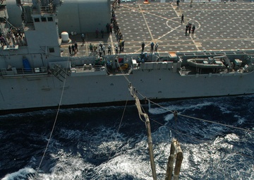 The USS Tarawa links up with USS Cleveland while underway