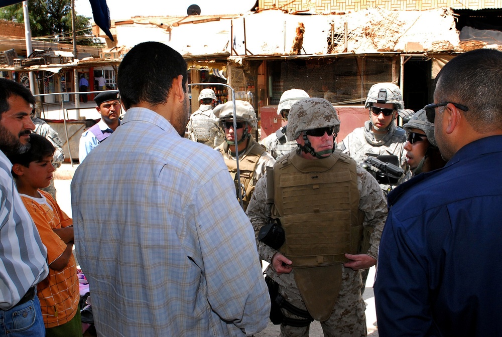 Marine Gen. Visits Troops, Talks to Local Populace