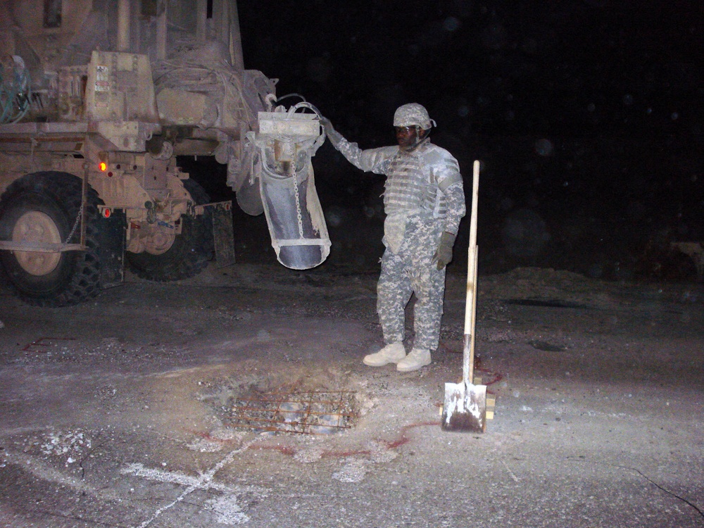 Soldiers from Mississippi's 230th Concrete Team patches roads after IED blasts