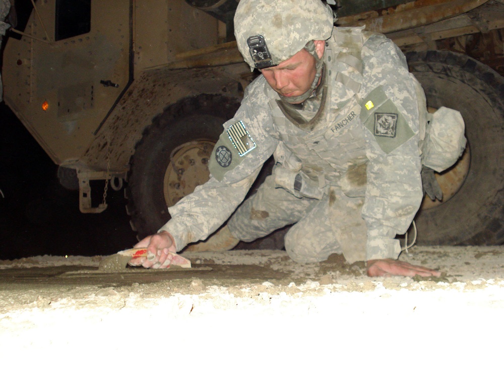 Soldiers from Mississippi's 230th Concrete Team patches roads after IED blasts