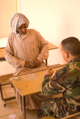 Coalition forces bring aid to village