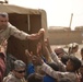 Coalition forces bring aid to village