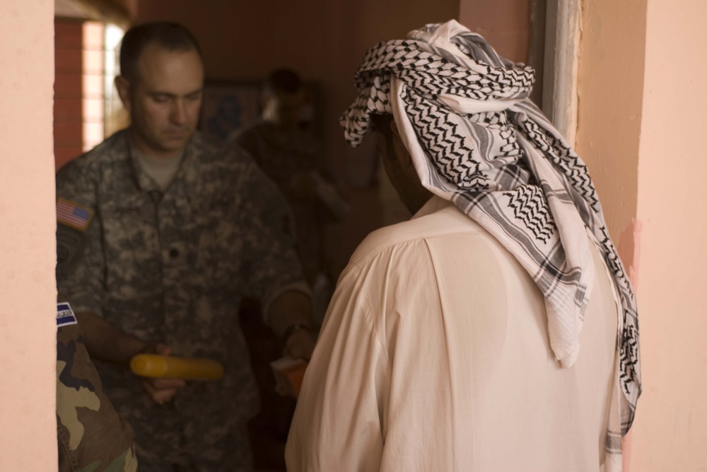 Coalition forces bring aid to village
