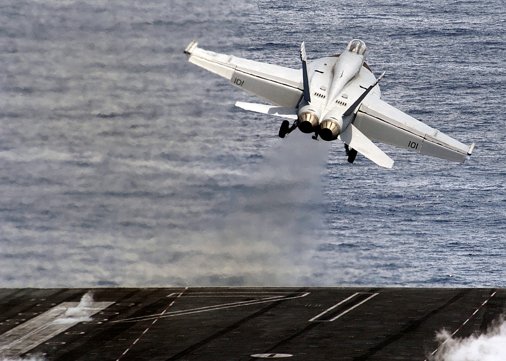 Super Hornets roar over the Theodore Roosevelt