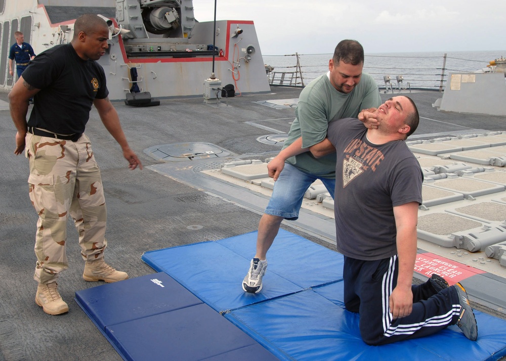 USS Bulkeley Sailors practice hand-to-hand combat techniques