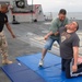 USS Bulkeley Sailors practice hand-to-hand combat techniques