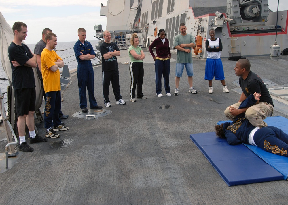 USS Bulkeley Sailors practice hand-to-hand combat techniques