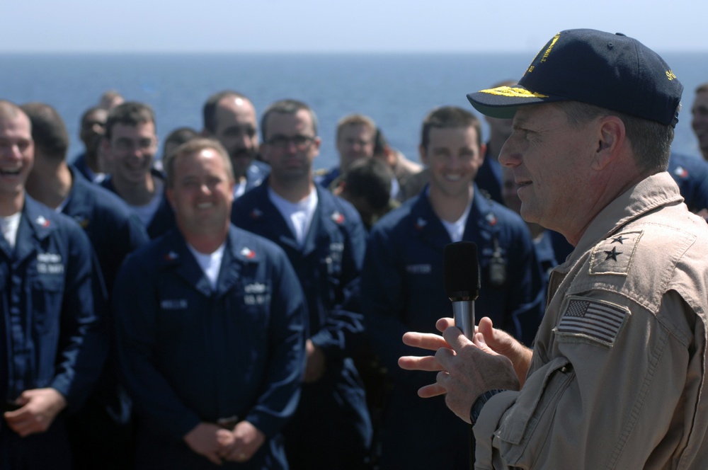 Carrier Strike Group commander talks with USS Winston S. Churchill crewmembers