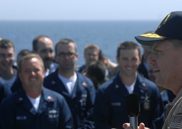 Carrier Strike Group commander talks with USS Winston S. Churchill crewmembers