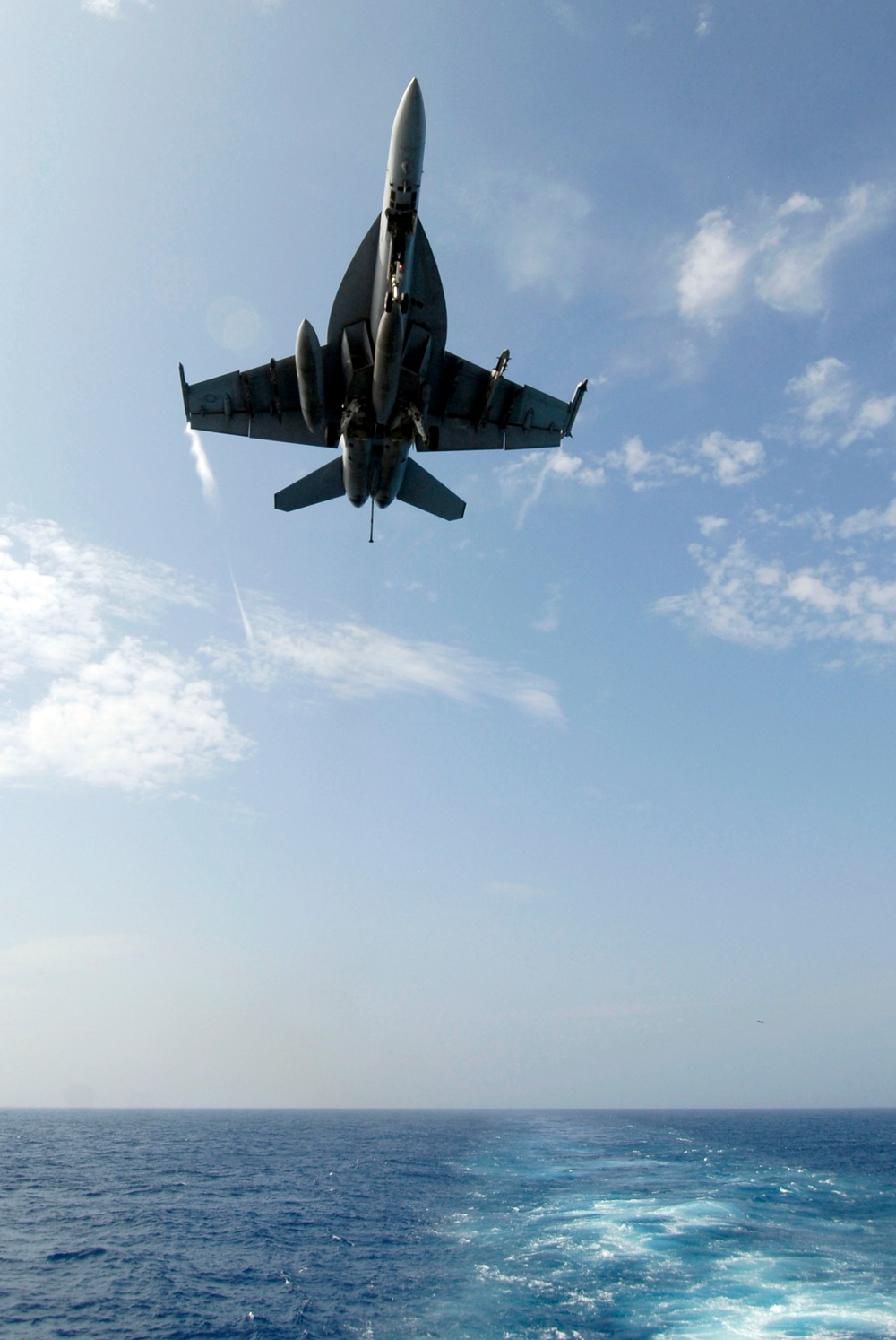 Short Hornets landing in aboard USS Kitty Hawk