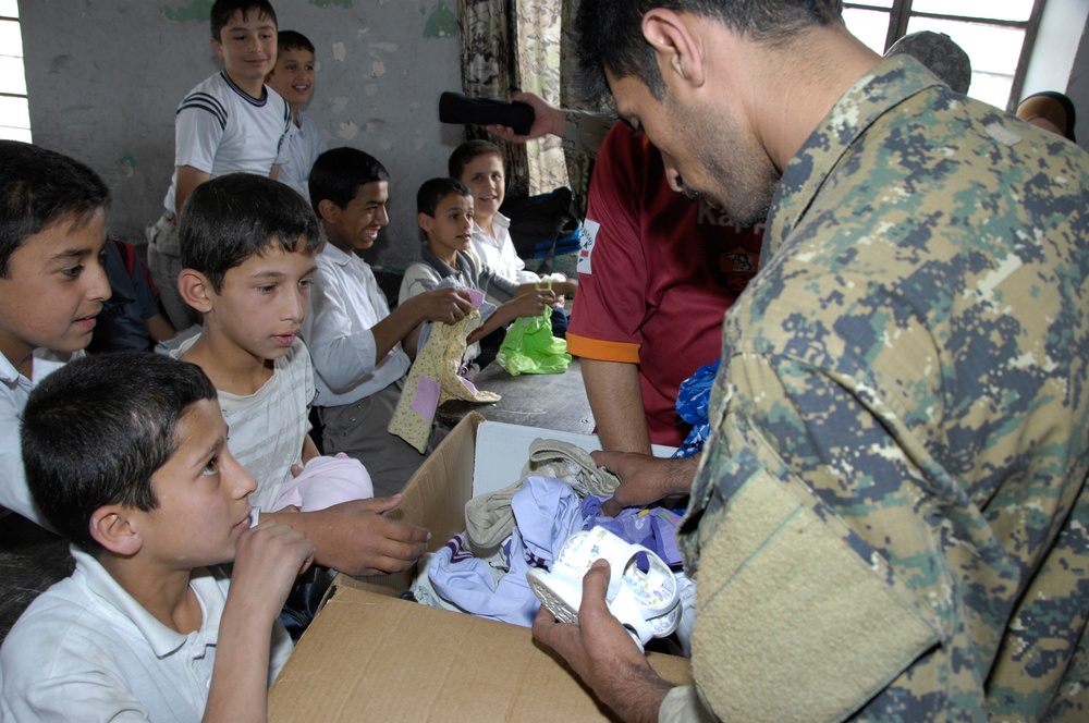 Handing Out Clothes and Toys