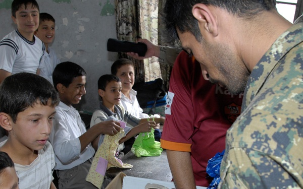 Handing Out Clothes and Toys