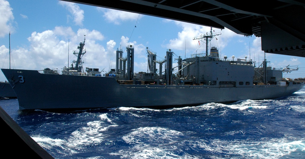 USNS Niagara Falls conducts an underway replenishment with the USS Nimitz
