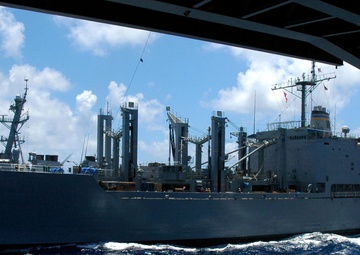 USNS Niagara Falls conducts an underway replenishment with the USS Nimitz