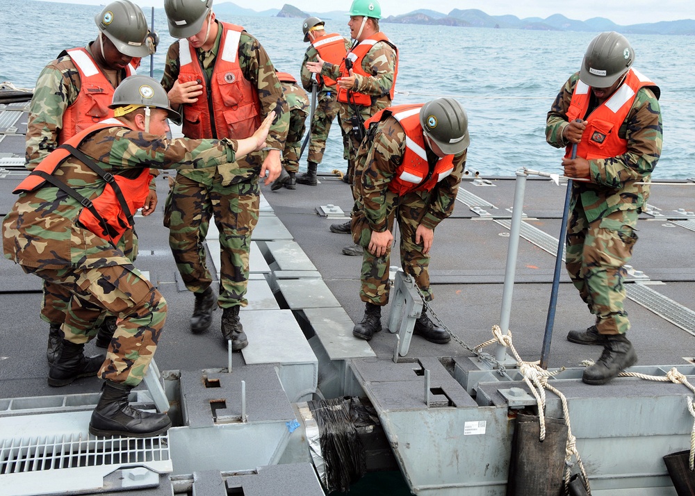 Naval supply ships drop off gear for exercise Cobra Gold