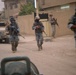 Iraqi army, national police join together; find weapons cache