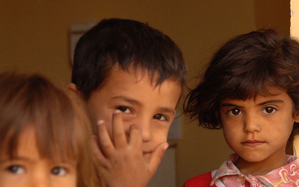 Iraqi Children Watch a Patrol