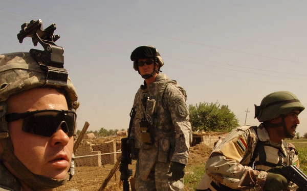 U.S. and Iraqi Soldiers Stand Ready