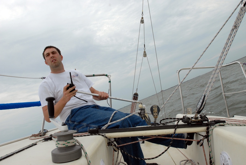 Sailors race sailboats off Norfolk