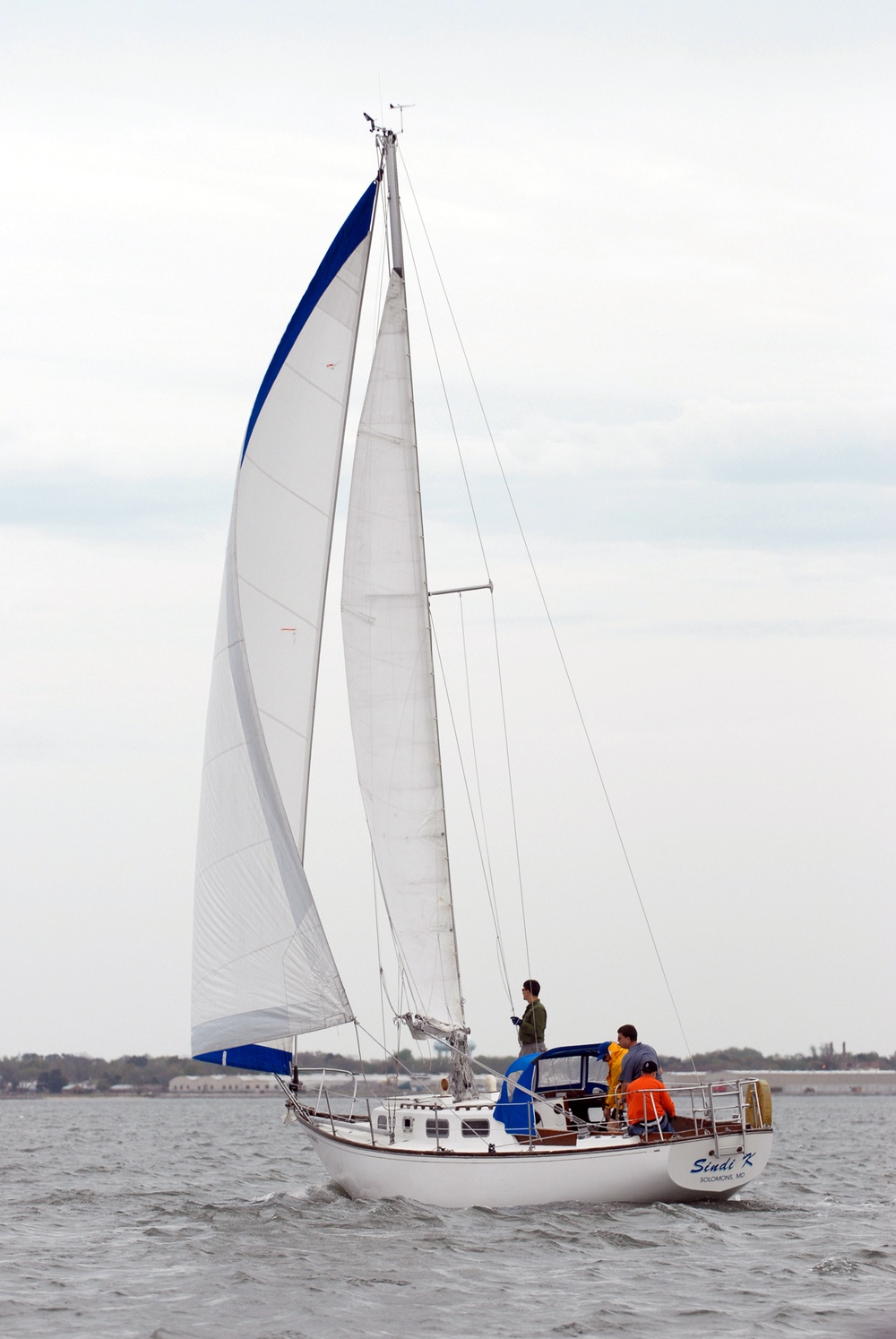 Sailors race sailboats off Norfolk